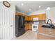 Well-lit kitchen featuring stainless steel appliances, tile floors, and ample counter space at 4225 Sw 57Th Ave, Ocala, FL 34474