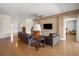 Inviting living room with wood floors, a ceiling fan, and comfortable couches, perfect for relaxing and entertaining at 4225 Sw 57Th Ave, Ocala, FL 34474