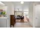 Open-concept living room with tile floors, flowing into dining area and featuring access to the patio at 4225 Sw 57Th Ave, Ocala, FL 34474