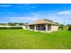An enclosed lanai, attached to a home and overlooking a green lawn at 4225 Sw 57Th Ave, Ocala, FL 34474