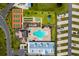 Aerial view showcasing community amenities including a pool, tennis courts, and RV parking at 4345 Nw 27Th Pl, Ocala, FL 34482