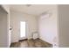 Bright, empty bedroom with closet drawers and an exit door at 4345 Nw 27Th Pl, Ocala, FL 34482