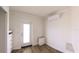 Minimalist bedroom featuring white walls, wood-look flooring, and functional built-in storage solutions at 4345 Nw 27Th Pl, Ocala, FL 34482