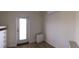 Bright bedroom with hardwood flooring, built-in storage and a door leading to the exterior at 4345 Nw 27Th Pl, Ocala, FL 34482