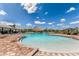 Large community pool with a Tiki bar, ample seating, and clear blue water at 4345 Nw 27Th Pl, Ocala, FL 34482