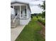 Cozy cottage with a welcoming porch, landscaped grounds, and serene surroundings in a residential area at 4345 Nw 27Th Pl, Ocala, FL 34482