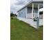 Inviting cottage with cozy porch, framed by green lawn and neat landscaping in a peaceful setting at 4345 Nw 27Th Pl, Ocala, FL 34482