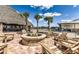 Outdoor fire pit lounge area with chairs near the Tiki bar at 4345 Nw 27Th Pl, Ocala, FL 34482