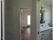 Hallway with view into a bathroom at 4345 Nw 27Th Pl, Ocala, FL 34482
