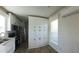 Modern kitchen with white cabinets, stainless steel appliances, and wood-look flooring, offering a clean aesthetic at 4345 Nw 27Th Pl, Ocala, FL 34482