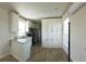 Bright, modern kitchen with white cabinetry, stainless steel appliances, and sleek countertops at 4345 Nw 27Th Pl, Ocala, FL 34482