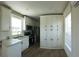 Charming kitchen with white cabinets, stainless appliances, and wood-look floors at 4345 Nw 27Th Pl, Ocala, FL 34482