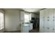 Well-lit kitchen with white cabinetry and stainless steel appliances at 4345 Nw 27Th Pl, Ocala, FL 34482