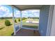 Charming porch with a view of the well-maintained lawn and common area at 4345 Nw 27Th Pl, Ocala, FL 34482