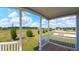 Exterior porch showcasing a spacious grassy area, perfect for outdoor enjoyment at 4345 Nw 27Th Pl, Ocala, FL 34482