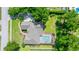 Stunning aerial view of home with a screened-in pool, lush landscaping, and well-manicured lawn at 4812 Se 12Th Pl, Ocala, FL 34471