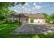 Features a basketball hoop and a three-car garage, perfect for recreational activities and parking at 4812 Se 12Th Pl, Ocala, FL 34471