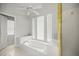 Elegant bathroom with soaking tub, separate shower, and bright natural light at 4812 Se 12Th Pl, Ocala, FL 34471