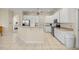 Spacious kitchen with white cabinets, stainless steel appliances, and a large island at 4812 Se 12Th Pl, Ocala, FL 34471