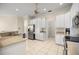 Bright kitchen featuring white cabinets, granite countertops, and stainless steel appliances at 4812 Se 12Th Pl, Ocala, FL 34471