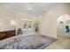 Spacious living room featuring French doors to the pool, and neutral carpeting at 4812 Se 12Th Pl, Ocala, FL 34471
