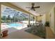 A screened-in pool area with seating offers a perfect outdoor entertaining space at 4812 Se 12Th Pl, Ocala, FL 34471