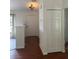 Bright foyer with hardwood floors leads into a freshly painted home, with a coat closet and views to the living room at 4911 Se 135Th Pl, Summerfield, FL 34491