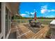 Outdoor deck features a dining set with an umbrella, perfect for enjoying meals and outdoor gatherings at 531 Ne 142Nd Ave, Silver Springs, FL 34488