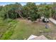 Spacious backyard with lush greenery, storage shed, and a camper; ideal for outdoor activities at 531 Ne 142Nd Ave, Silver Springs, FL 34488