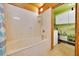 Bathroom boasts a built-in bathtub with a showerhead and a window offering natural light at 531 Ne 142Nd Ave, Silver Springs, FL 34488