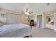Spacious bedroom featuring a ceiling fan, closet space, and access to other rooms at 531 Ne 142Nd Ave, Silver Springs, FL 34488