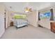 Comfortable bedroom with a ceiling fan, ample natural light, and a closet at 531 Ne 142Nd Ave, Silver Springs, FL 34488