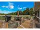Spacious deck furnished with outdoor seating, a grill, and scenic views under a partly cloudy sky at 531 Ne 142Nd Ave, Silver Springs, FL 34488