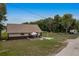 Home with a covered patio and parking on a large grassy lot; perfect for outdoor living at 531 Ne 142Nd Ave, Silver Springs, FL 34488