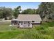 Charming home featuring a lovely deck, perfect for enjoying the surrounding greenery and nature at 531 Ne 142Nd Ave, Silver Springs, FL 34488