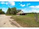 This home on a large lot has a covered parking area, patio, and fenced backyard at 531 Ne 142Nd Ave, Silver Springs, FL 34488