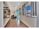 Bright sun room with hardwood floors, large windows, and access to an outdoor seating area at 531 Ne 142Nd Ave, Silver Springs, FL 34488