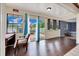 Bright sun room with view to the deck, featuring a desk and hardwood floors at 531 Ne 142Nd Ave, Silver Springs, FL 34488