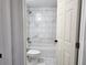 This bathroom offers tiled walls above the tub, and modern fixtures for a clean, updated look at 541 56Th Ct, Ocala, FL 34482