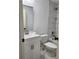 This bathroom showcases tiled walls above the tub with a sink vanity and modern fixtures at 541 56Th Ct, Ocala, FL 34482