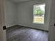 The bedroom offers natural light and a glimpse of the outdoors through a well-placed window at 541 56Th Ct, Ocala, FL 34482