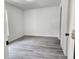 This bedroom features contemporary gray flooring and neutral walls, awaiting personalization at 541 56Th Ct, Ocala, FL 34482