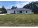 Inviting single-story home with a well-maintained lawn and attached single-car garage at 541 56Th Ct, Ocala, FL 34482