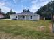Lovely single-Gathering home featuring a lush green lawn and an attached garage at 541 56Th Ct, Ocala, FL 34482