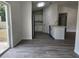 Open-concept kitchen with wood flooring and stainless steel appliances at 541 56Th Ct, Ocala, FL 34482