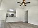 Open living space featuring wood floors and views of the kitchen and backyard at 541 56Th Ct, Ocala, FL 34482