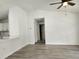 This living room showcases continuous flooring, ceiling fan, and a bright, airy atmosphere at 541 56Th Ct, Ocala, FL 34482