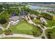 Gorgeous aerial view of the golf course, water features, clubhouse, and surrounding neighborhood at 6051 Sw 93Rd Cir, Ocala, FL 34481
