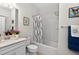 Bright bathroom featuring a sleek vanity, modern fixtures, and a stylish shower-tub combination at 6051 Sw 93Rd Cir, Ocala, FL 34481