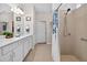 Bright bathroom featuring double vanity sinks, ample counter space, and a separate shower area at 6051 Sw 93Rd Cir, Ocala, FL 34481
